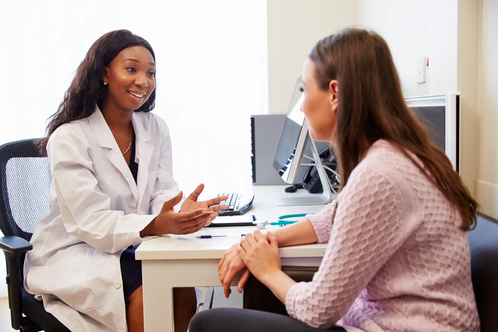 Physician consulting with a patient