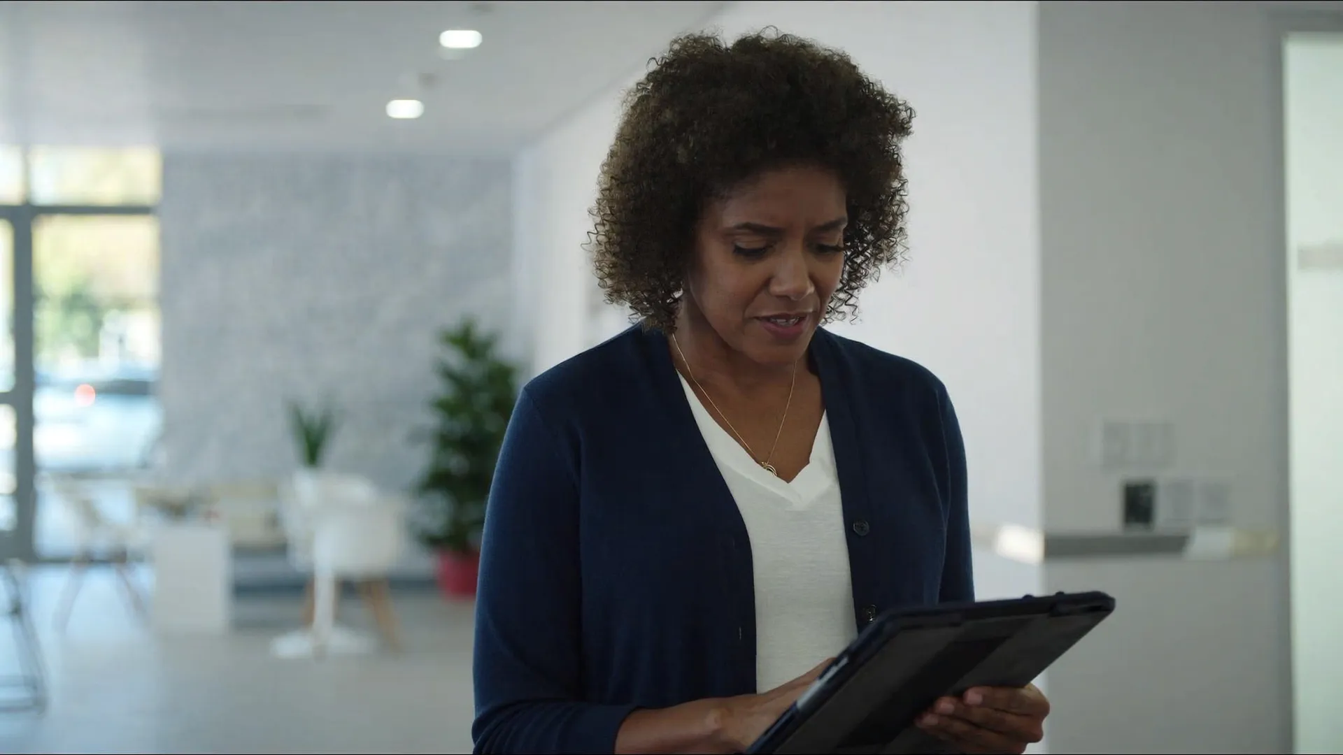 A practice manager reviewing financing on a tablet
